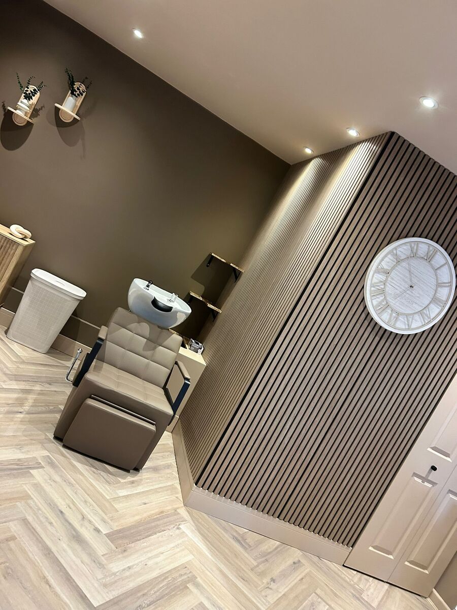 Backwash area with panelled feature wall and clock