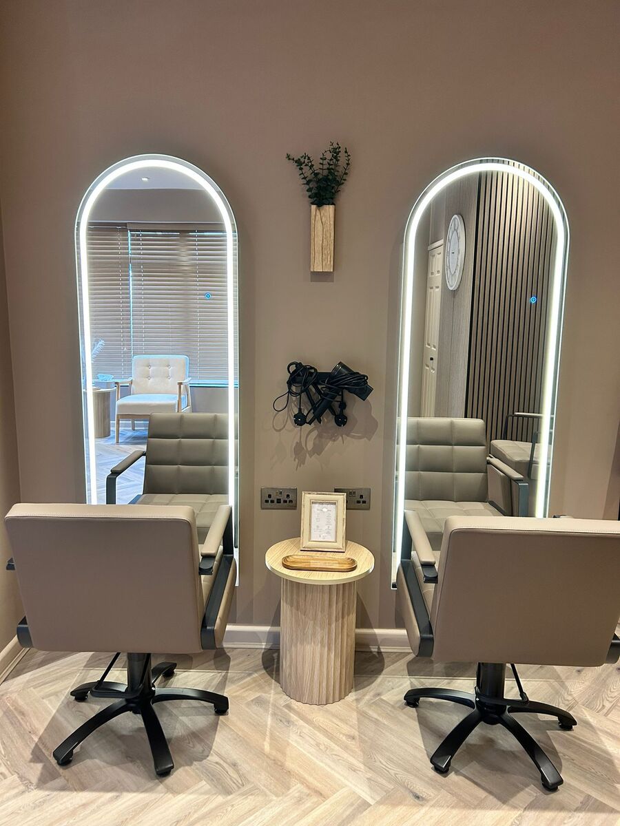 Two styling stations with arched LED mirrors